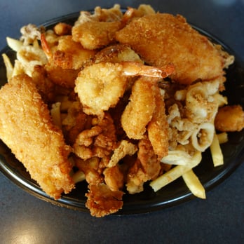 Neptune's Net - Neptune Sampler - Fish, shrimp, scallop, clam strips, crab cake, calamari and fries. - Seafood Near Me - Malibu, California