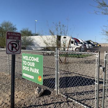 Love's Travel Stop - a parking lot with a sign that says welcome to our dog park - Convenience Stores Near Me - Yuma, Arizona