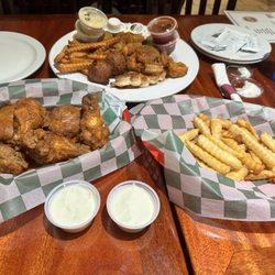 Badeaux's Seafood & Grill - Seafood combo, fries (regular and sweet potato) and wings tossed in Cajun seasoning.