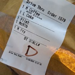 Flat Coke, old cold fries.15 minute wait. Meh