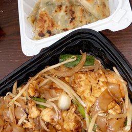 two take out containers of food two take out containers of food
