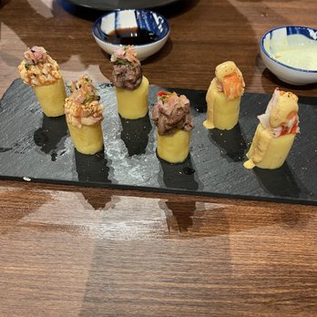 nikkei robata - Food, Causa Platter, Peruvian mashed potato bites topped with ebi, wagyu and salmon tartare, chalaquita, sesame oil, guacamole - Japanese Near Me
