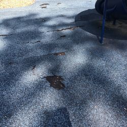 Howard Peeples Park - Delapitated safety matting. Do not leave little tots to pick and eat at the holes