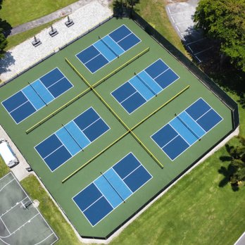 Armor Courts - a tennis court surrounded by trees - Tennis Near Me - Boynton Beach, Florida Armor Courts - a tennis court surrounded by trees - Tennis Near Me - Boynton Beach, Florida