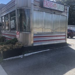 a taco truck parked in a parking lot