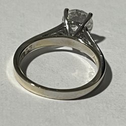 Bernie's & Son Jewelers - Damage on the band we believe caused after they engraved it, during polishing. Other jewelers we've talked with agree with us.
