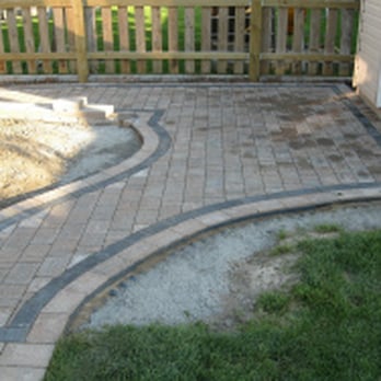 CBX Landscaping - a brick patio with a curved design - Landscaping Near Me CBX Landscaping - a brick patio with a curved design - Landscaping Near Me