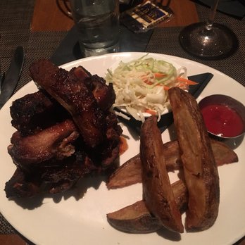 Roadside B&G - My ribs... carmalized sauce and meaty goodness... got an extra order to go. - New American Near Me - Bloomfield Township, Michigan