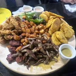 Picadillos fritas for 2. It included chicharron de pollo, langunisa, tostones, carne saltada, jamón and queso frito.