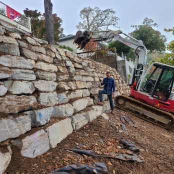 Holly Tree Landscaping & Retaining Walls - a man and a bulldozer - Landscaping Near Me Holly Tree Landscaping & Retaining Walls - a man and a bulldozer - Landscaping Near Me