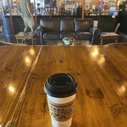 CouchLand Coffee House - Hot honey lavender latte and counter area