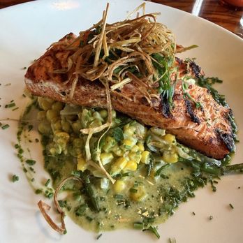 Toulouse Petit Kitchen & Lounge - "Creole style" king salmon - they lied about the creole, severely under-seasoned. The veggie stuff underneath was good - Seafood Near Me - Seattle, Washington Toulouse Petit Kitchen & Lounge - "Creole style" king salmon - they lied about the creole, severely under-seasoned. The veggie stuff underneath was good - Seafood Near Me - Seattle, Washington
