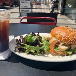 Chicken sandwich and an Iced Americano Chicken sandwich and an Iced Americano