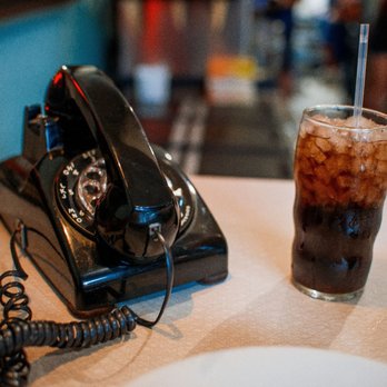 Pop's Ice Cream & Soda Bar - An old phone that is a decoration next to my house-made cola, which was fantastic. - Ice Cream & Frozen Yogurt Near Me - Roanoke, Virginia