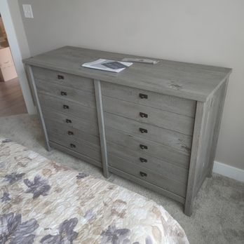 Top Notch Home Remodeling - a dresser and bed - General Contractors Near Me Top Notch Home Remodeling - a dresser and bed - General Contractors Near Me