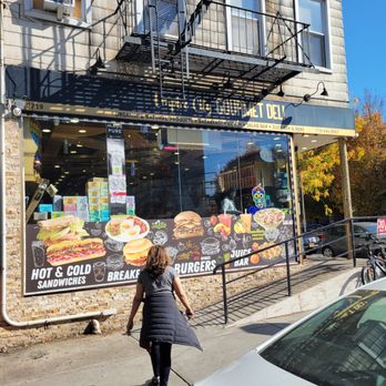 Empire State Deli Grocery - a woman walking down the sidewalk - Convenience Stores Near Me - New York, New York Empire State Deli Grocery - a woman walking down the sidewalk - Convenience Stores Near Me - New York, New York