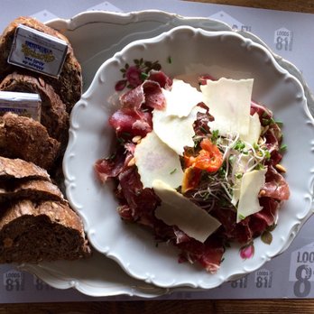 LOODS81 - Uit het eigen worstenatelier: Gezouten en gerijpte Argentijnse ribeye met frisée, citroenolie en pecorino. - Breakfast & Brunch Near Me - Margraten, LI LOODS81 - Uit het eigen worstenatelier: Gezouten en gerijpte Argentijnse ribeye met frisée, citroenolie en pecorino. - Breakfast & Brunch Near Me - Margraten, LI