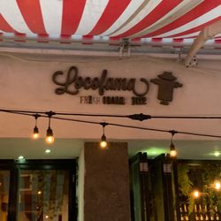 Locofama - Front under awning. The sign is almost hidden.