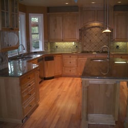 Creation Stone LLC - granite slab w/ travertine backsplash