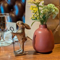 Rabbit/hare tabletop decor and centerpiece flowers in our booth. Nice little touches here.