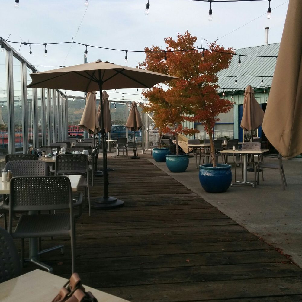 patio area with tables and umbrellas