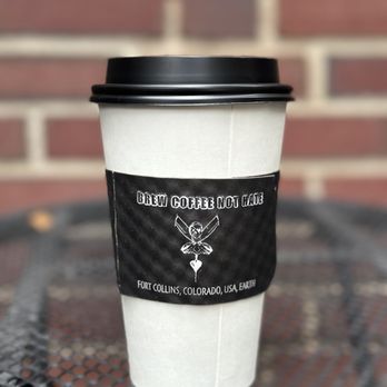 Mugs Old Town - a cup of coffee on a table - Coffee & Tea Near Me - Fort Collins, Colorado