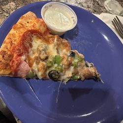 Desert Star Theater - Slice of supreme pizza with ranch dressing on the side