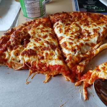 Milan Pizzeria - a half eaten pizza - Pizza Near Me - Longueuil, Quebec Milan Pizzeria - a half eaten pizza - Pizza Near Me - Longueuil, Quebec