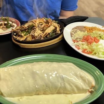 La Guacamaya - a person eating a burrito - Mexican Near Me - Clinton, Wisconsin
