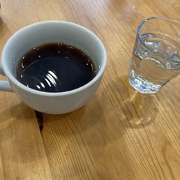 Comforting mug of Sumatra and water glass Comforting mug of Sumatra and water glass