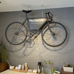 Velodrome Coffee - Sign above the condiment area.