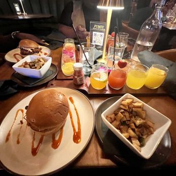 Fumée  - Chicken sandwich, potatoes, and mimosa flight - Cocktail Bars Near Me - Charlotte, North Carolina