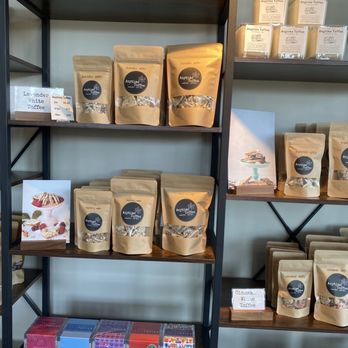 Anytime Toffee, Coffee & Gifts - a shelf of coffee bags - Candy Stores Near Me - Ferndale, Washington