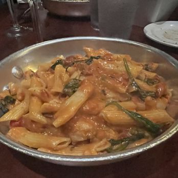 Carmelina's - Penne Capricciose spinach, roasted red peppers, roasted garlic, tomato cream sauce. - Italian Near Me - Boston, Massachusetts