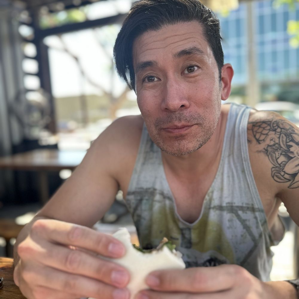 I Luv Ur Buns - My husband Rich enjoying his Seoul on Fire  Bao. - Asian Fusion Near Me - Long Beach, California