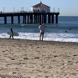 The Strand Manhattan Beach - Surfer and dog owner near the pier