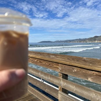 Breezeway Cafe - a hand holding a cup of iced coffee - Breakfast & Brunch Near Me - Pismo Beach, California