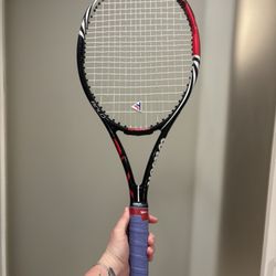 Empire Racquet - The dampener he gave me out of his car (the original one was a long vertical Wilson dampener) and again the tape and wrong grip