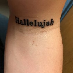 One-Eyed Blue Monkey Tattooing - Very disappointed. All three L's are different including the two A's. At least he spelled it right though.