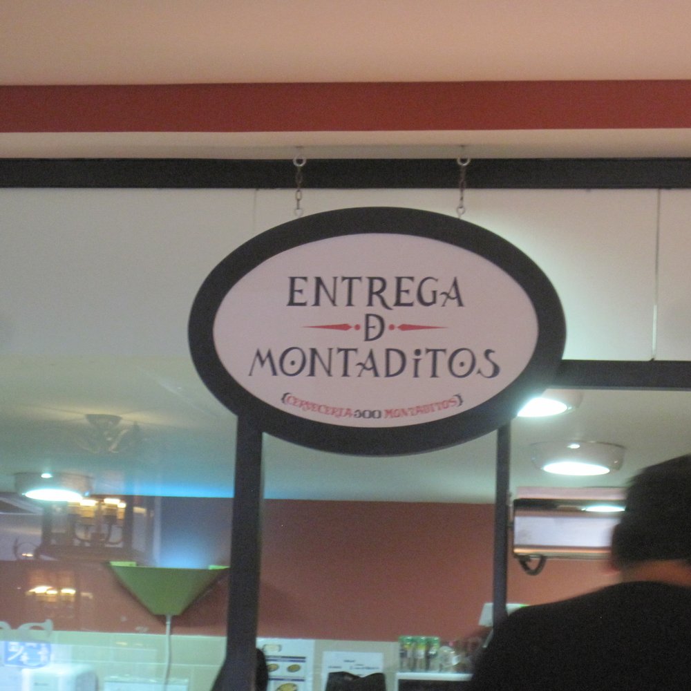 100 Montaditos - I don't know what this says, but it is where you pick up the food. - Tapas/Small Plates Near Me - Madrid, M 100 Montaditos - I don't know what this says, but it is where you pick up the food. - Tapas/Small Plates Near Me - Madrid, M