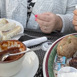 Waterfront Marys Bar and Grill - Tilapia with Baked Potato, 16oz Ribeye with Baked Potato. Both delish!