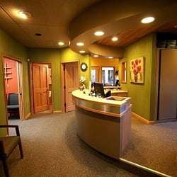 Tom S Rohdy, DDS - Modern front desk area with private consultation room