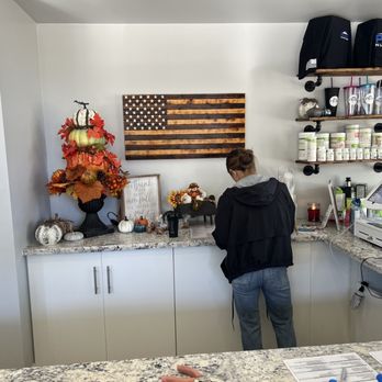 Peak Nutrition - a woman standing in a kitchen - Juice Bars & Smoothies Near Me - Cameron Park, California Peak Nutrition - a woman standing in a kitchen - Juice Bars & Smoothies Near Me - Cameron Park, California