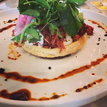 Xochi - Memelita De Pollo Con Mole Negro toasted masa pancake, chicken, black mole - Mexican Near Me - Houston, Texas