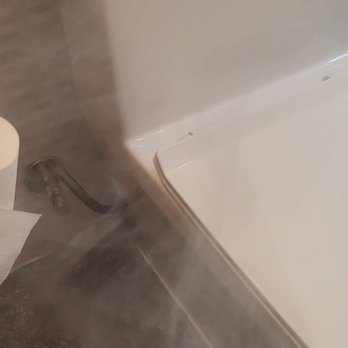 Revive 360 Renovations - smoke test revealing gas smell at floor under toilet - General Contractors Near Me - Chicago, Illinois