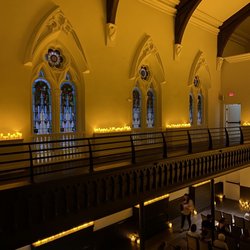 The Transept - Left side view of balcony of the stain glass windows and beams