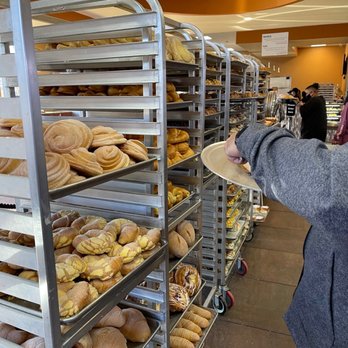 Guanajuato Bakery - a woman holding a tray of bread - Bakeries Near Me - Fort Worth, Texas Guanajuato Bakery - a woman holding a tray of bread - Bakeries Near Me - Fort Worth, Texas