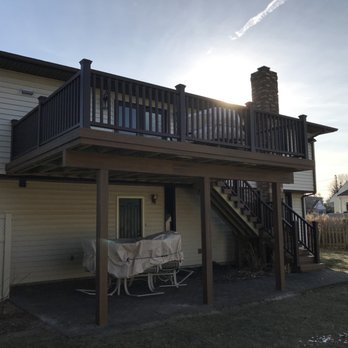 Decks Unique - Hard to see the actual deck, but looks nice with the sun behind it!!! - Decks & Railing Near Me - Commack, New York