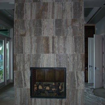 Natural Stone Designs - a fireplace in a living room - General Contractors Near Me - Carrollton, Texas Natural Stone Designs - a fireplace in a living room - General Contractors Near Me - Carrollton, Texas