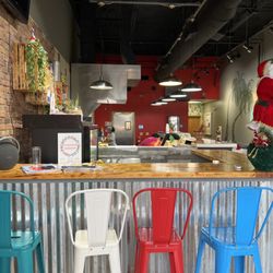 Delicias Latin Food And Bar - View of the small bar towards the open kitchen. So cute in here!